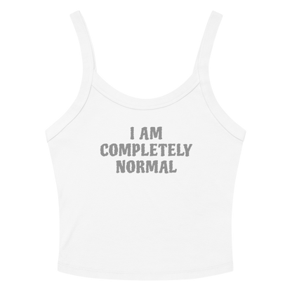 "I am completely normal" printed on a solid white blend women's micro-rib tanktop laying on a flat surface amongst sunglasses and shorts