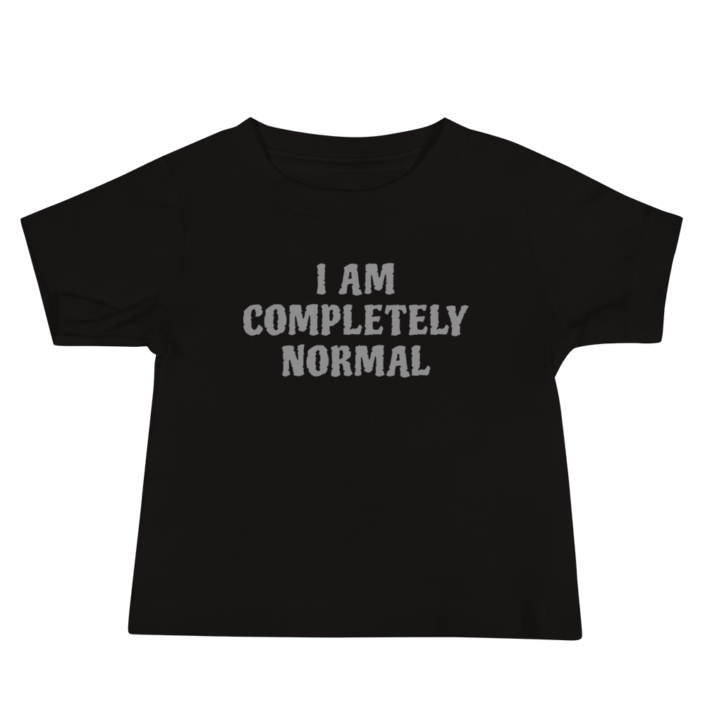 "I am completely normal" printed on a black baby jersey short sleeve tee laying on a flat surface