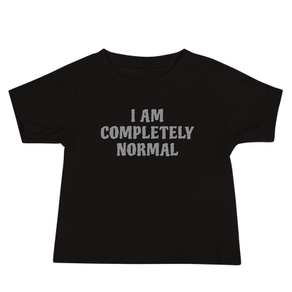 "I am completely normal" printed on a black baby jersey short sleeve tee laying on a flat surface