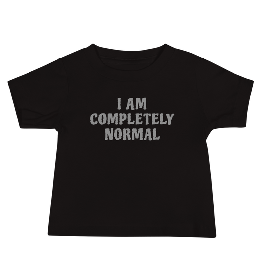 "I am completely normal" printed on a black baby jersey short sleeve tee laying on a flat surface