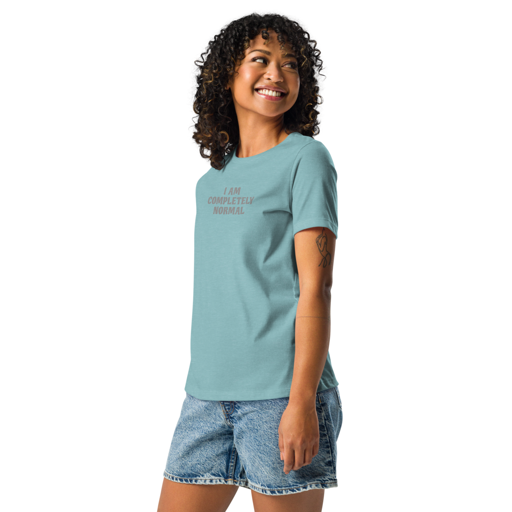 "I am completely normal" printed on a heather blue lagoon women's relaxed t-shirt worn by a female