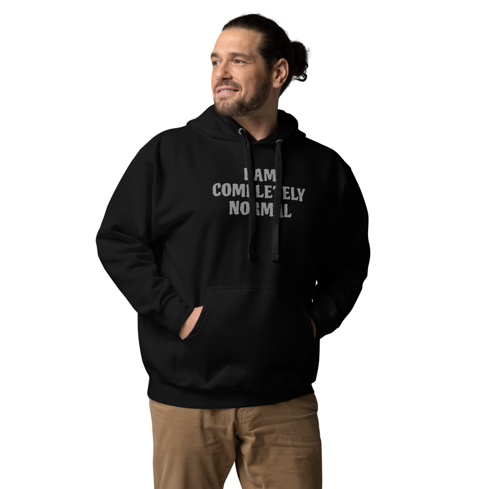 "I am completely normal" printed on a black unisex hoodie worn by a male