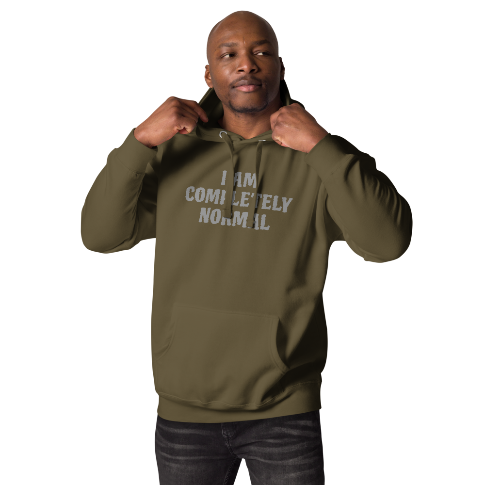 "I am completely normal" printed on a military green unisex hoodie worn by a male
