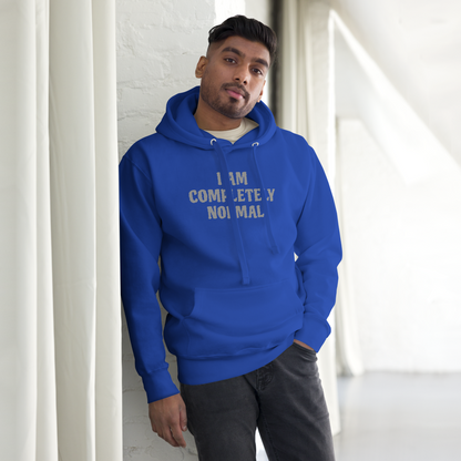 "I am completely normal" printed on a team royal unisex hoodie worn by a male