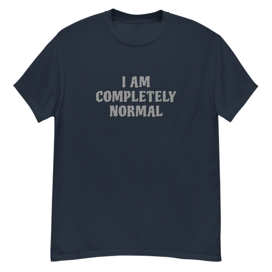 "I am completely normal" printed on a navy unisex classic tee laying on a flat surface
