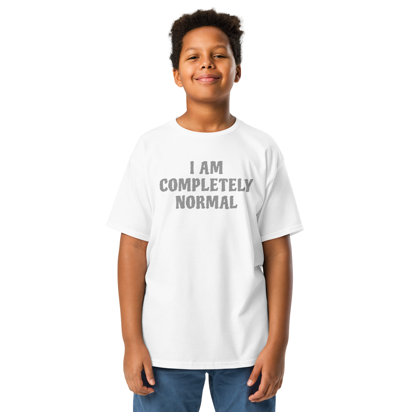 "I am completely normal" printed on a white youth classic tee worn by a male