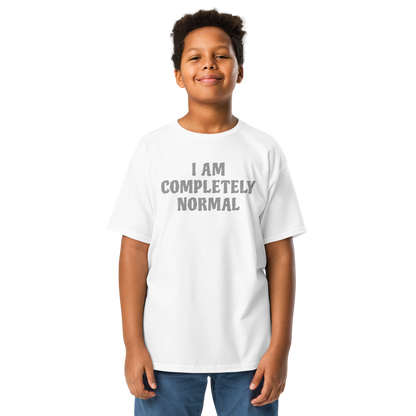"I am completely normal" printed on a white youth classic tee worn by a male