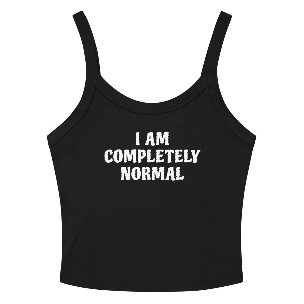 "I am completely normal" printed on a solid black blend women's micro-rib tanktop laying on a flat surface amongst sunglasses and shorts