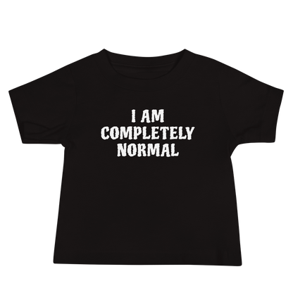 "I am completely normal" printed on a black baby jersey short sleeve tee laying on a flat surface