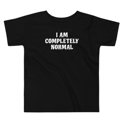 "I am completely normal" printed on a black toddler short sleeve tee laying on a flat surface