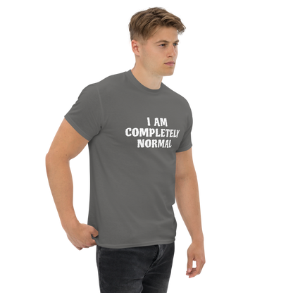"I am completely normal" printed on a charcoal unisex classic tee worn by a male
