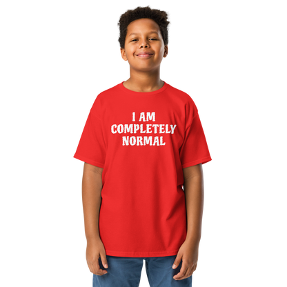 "I am completely normal" printed on a red youth classic tee worn by a male