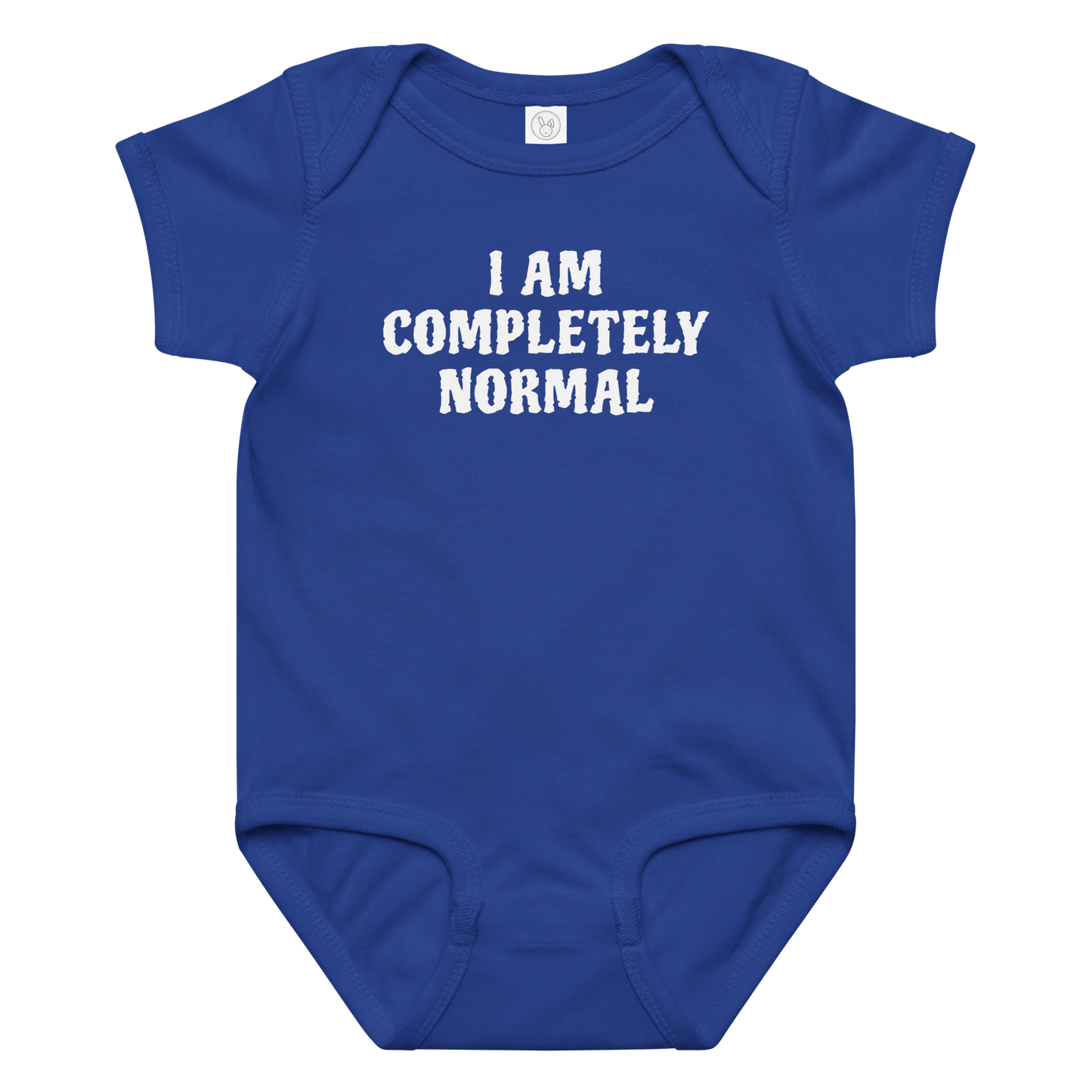 "I am completely normal" printed on a royal baby jersey bodysuit laying on a flat surface amongst other clothes