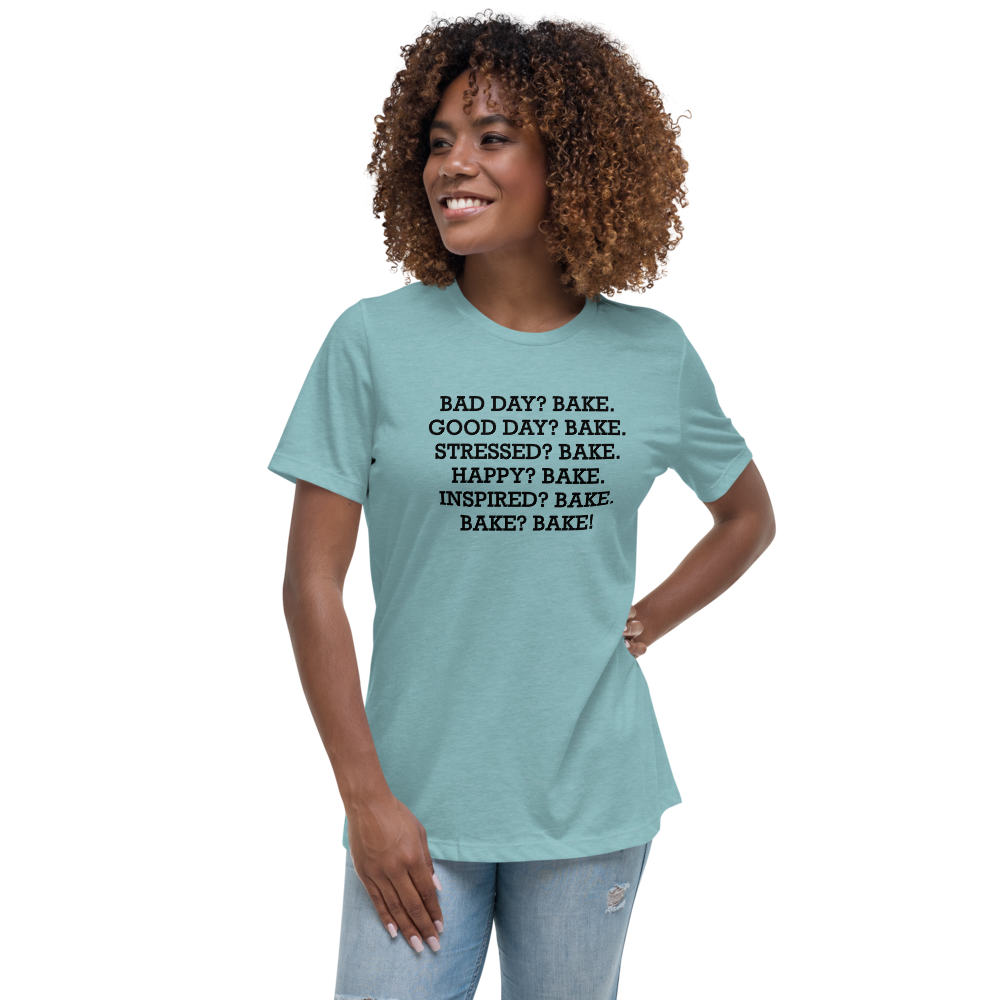 "Bad Day? Bake. Good Day? Bake. Stressed? Bake. Happy? Bake. Inspired? Bake. Bake? Bake!" printed on a heather blue lagoon women's relaxed t-shirt worn by a female