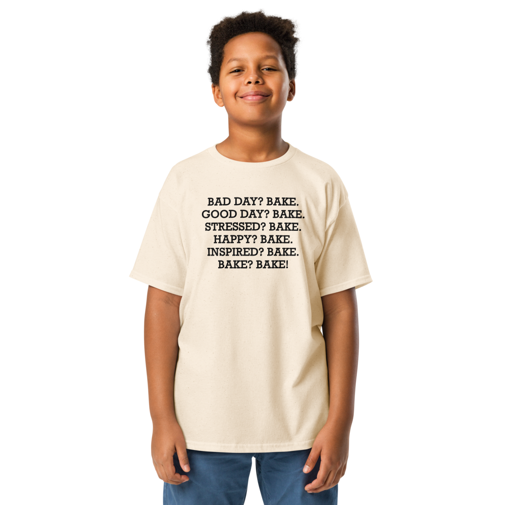 "Bad Day? Bake. Good Day? Bake. Stressed? Bake. Happy? Bake. Inspired? Bake. Bake? Bake!" printed on a natural youth classic tee worn by a male