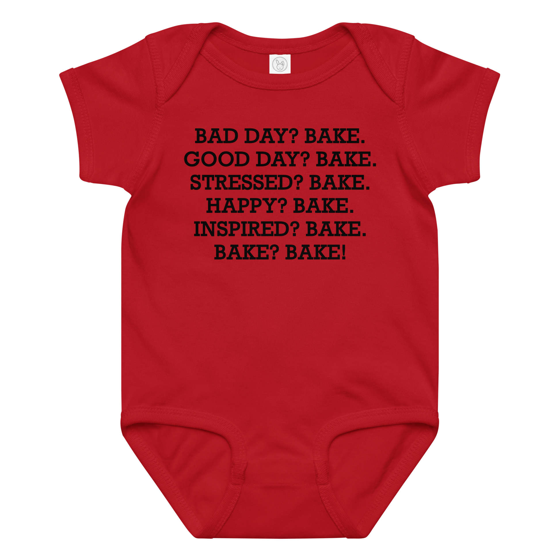 "Bad Day? Bake. Good Day? Bake. Stressed? Bake. Happy? Bake. Inspired? Bake. Bake? Bake!" printed on a red baby jersey bodysuit laying on a flat surface amongst other clothes