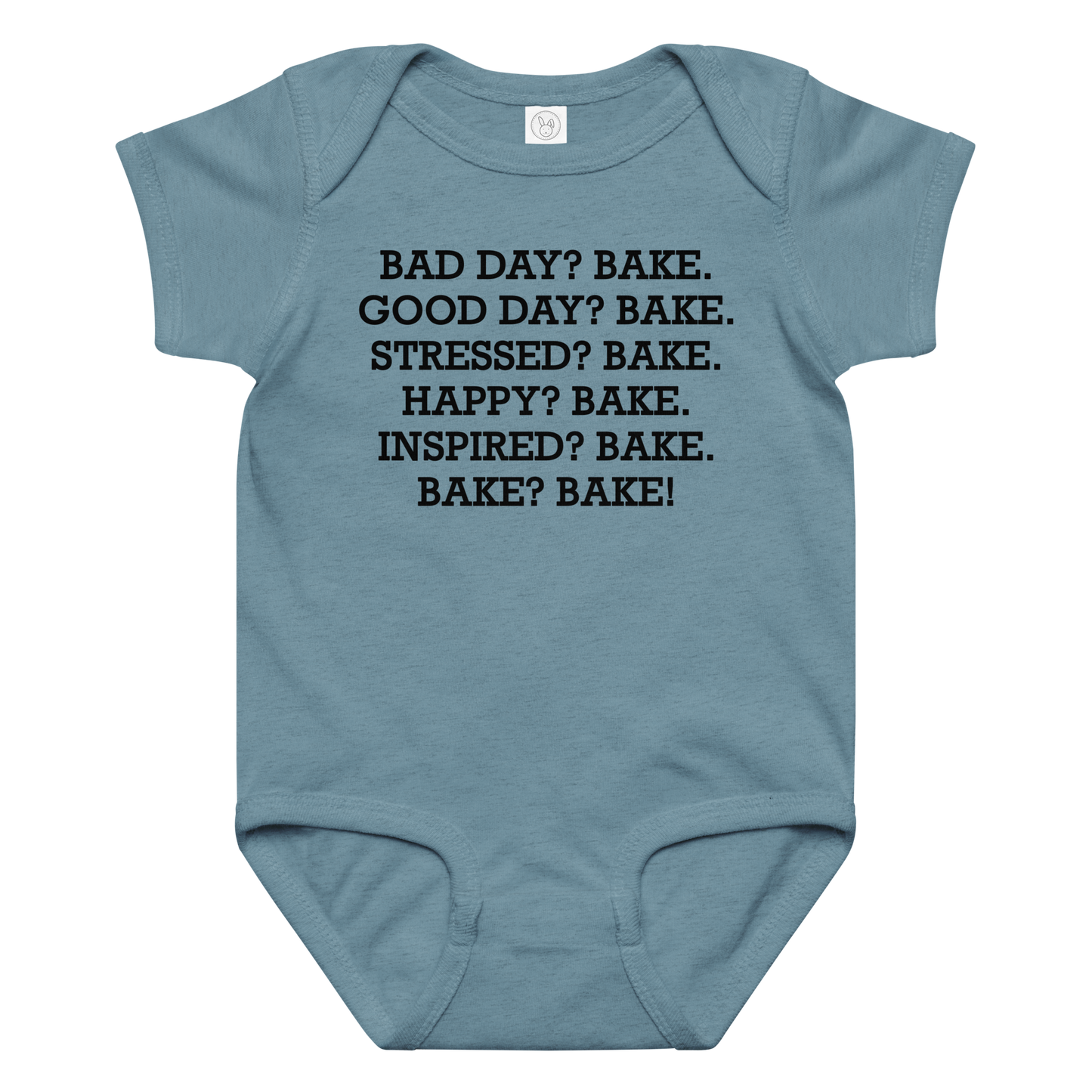 "Bad Day? Bake. Good Day? Bake. Stressed? Bake. Happy? Bake. Inspired? Bake. Bake? Bake!" printed on a vintage indigo baby jersey bodysuit laying on a flat surface amongst other clothes