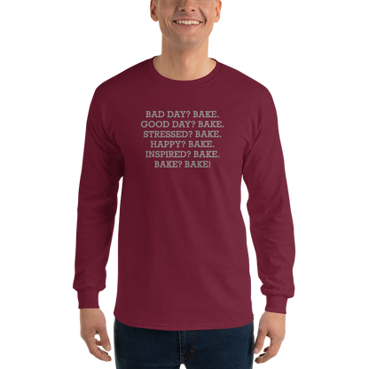 "Bad Day? Bake. Good Day? Bake. Stressed? Bake. Happy? Bake. Inspired? Bake. Bake? Bake!" printed on a maroon men's long sleeve shirt worn by a male