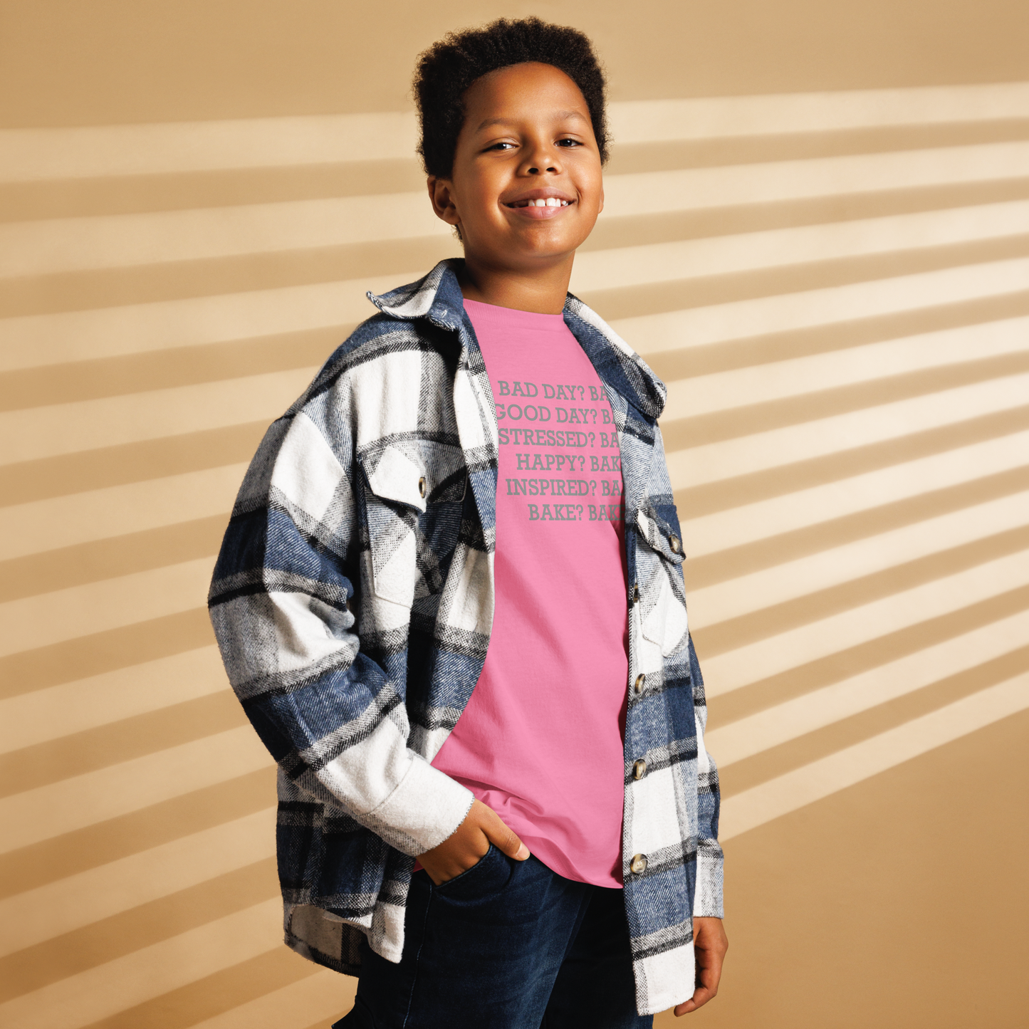 "Bad Day? Bake. Good Day? Bake. Stressed? Bake. Happy? Bake. Inspired? Bake. Bake? Bake!" printed on a azalea youth classic tee worn by a male also wearing a jacket