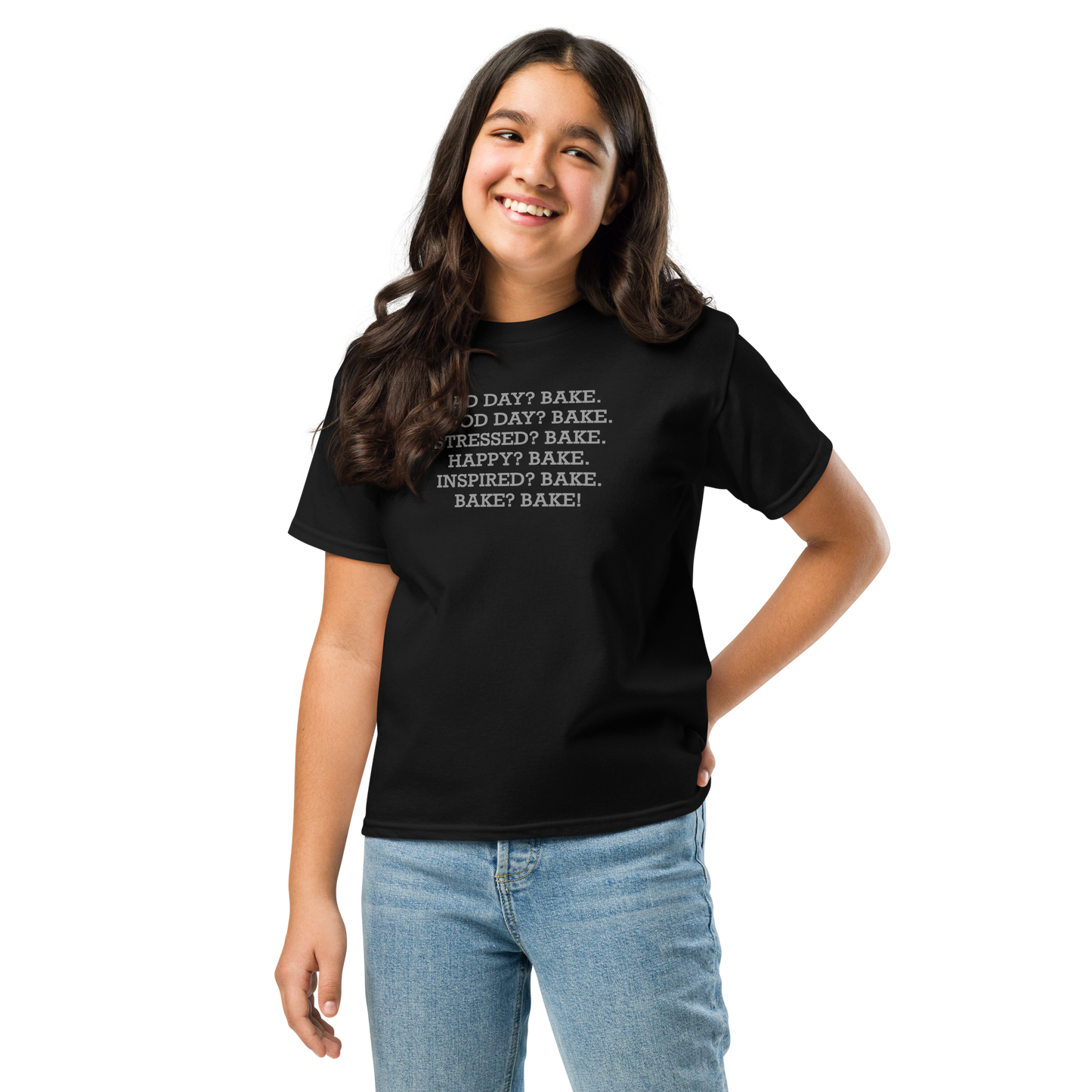 "Bad Day? Bake. Good Day? Bake. Stressed? Bake. Happy? Bake. Inspired? Bake. Bake? Bake!" printed on a black youth classic tee worn by a female