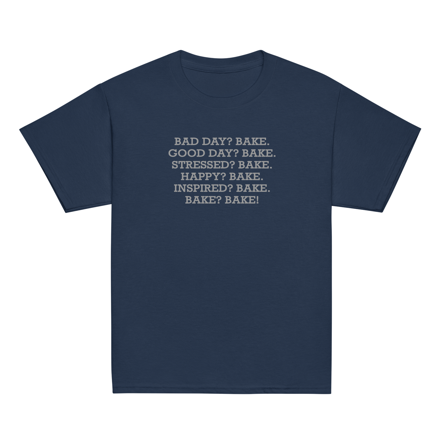 "Bad Day? Bake. Good Day? Bake. Stressed? Bake. Happy? Bake. Inspired? Bake. Bake? Bake!" printed on a navy youth classic tee laying on a flat surface