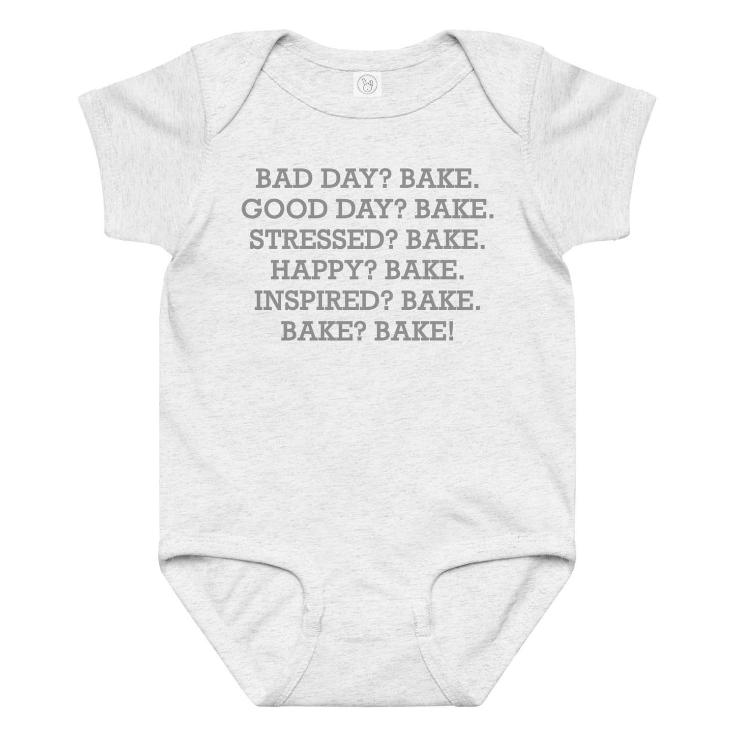 "Bad Day? Bake. Good Day? Bake. Stressed? Bake. Happy? Bake. Inspired? Bake. Bake? Bake!" printed on a ash baby jersey bodysuit laying on a flat surface amongst other clothes