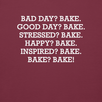 "Bad Day? Bake. Good Day? Bake. Stressed? Bake. Happy? Bake. Inspired? Bake. Bake? Bake!" printed on a maroon background