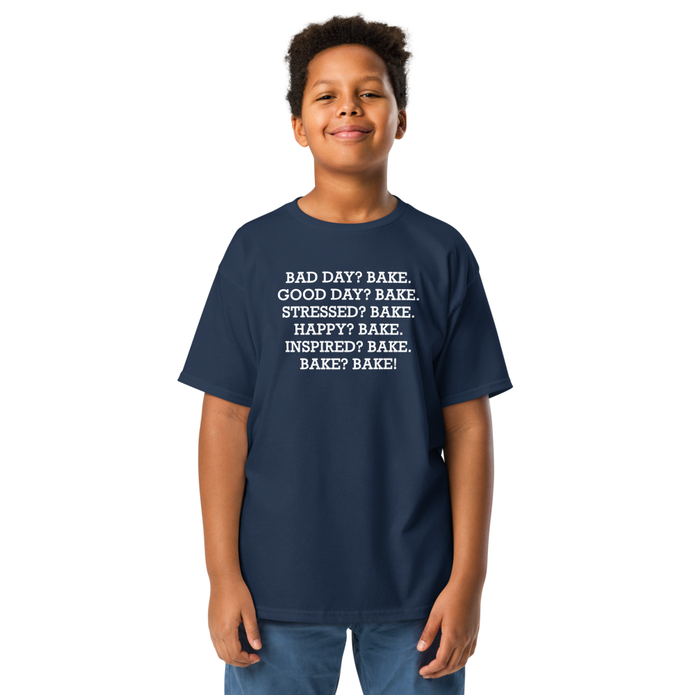 "Bad Day? Bake. Good Day? Bake. Stressed? Bake. Happy? Bake. Inspired? Bake. Bake? Bake!" printed on a navy youth classic tee worn by a male