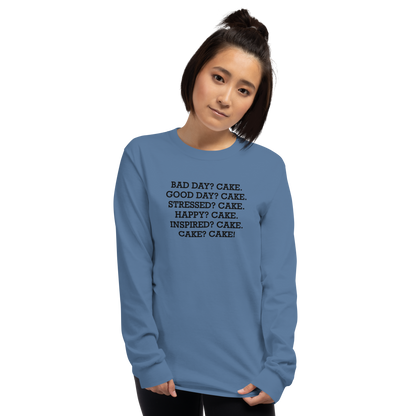 "Bad Day? Cake. Good Day? Cake. Stressed? Cake. Happy? Cake. Inspired? Cake. Cake? Cake!" printed on a indigo blue men's long sleeve shirt worn by a female