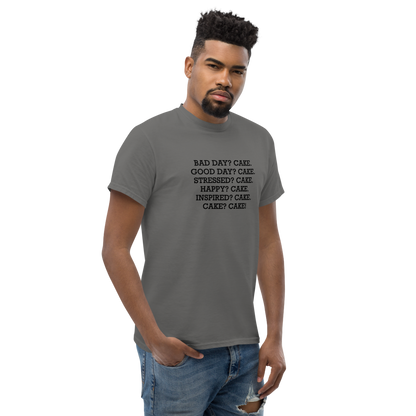 "Bad Day? Cake. Good Day? Cake. Stressed? Cake. Happy? Cake. Inspired? Cake. Cake? Cake!" printed on a charcoal unisex classic tee worn by a male