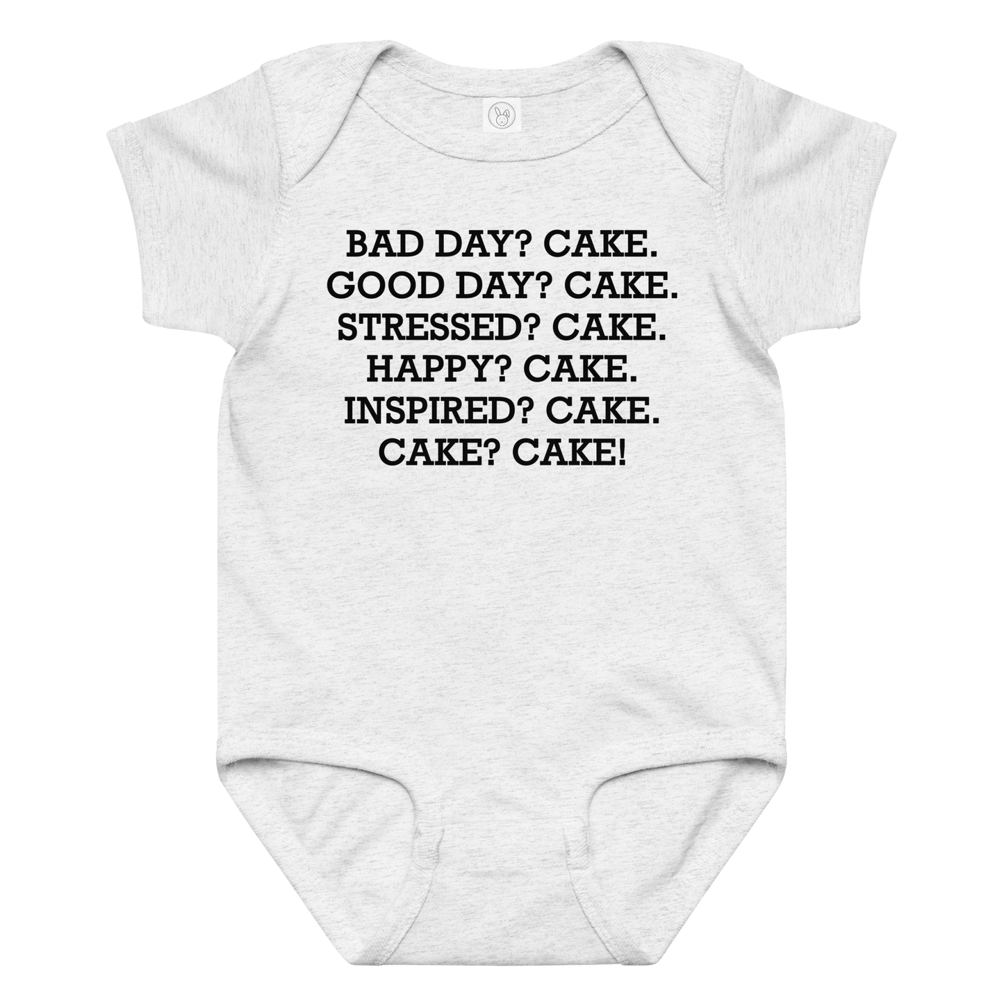 "Bad Day? Cake. Good Day? Cake. Stressed? Cake. Happy? Cake. Inspired? Cake. Cake? Cake!" printed on a ash baby jersey bodysuit laying on a flat surface amongst other clothes