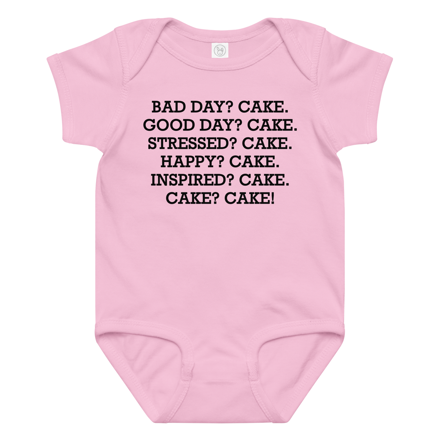 "Bad Day? Cake. Good Day? Cake. Stressed? Cake. Happy? Cake. Inspired? Cake. Cake? Cake!" printed on a pink baby jersey bodysuit laying on a flat surface amongst other clothes