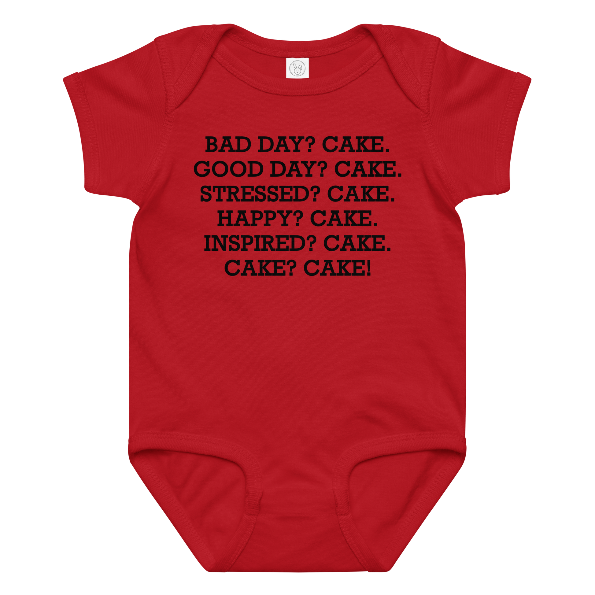 "Bad Day? Cake. Good Day? Cake. Stressed? Cake. Happy? Cake. Inspired? Cake. Cake? Cake!" printed on a red baby jersey bodysuit laying on a flat surface amongst other clothes