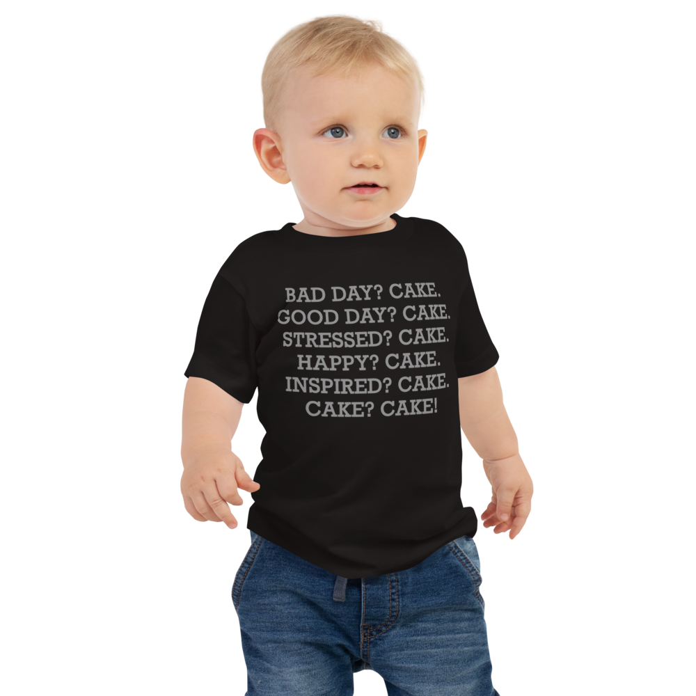 "Bad Day? Cake. Good Day? Cake. Stressed? Cake. Happy? Cake. Inspired? Cake. Cake? Cake!" printed on a black baby jersey short sleeve tee worn by a male