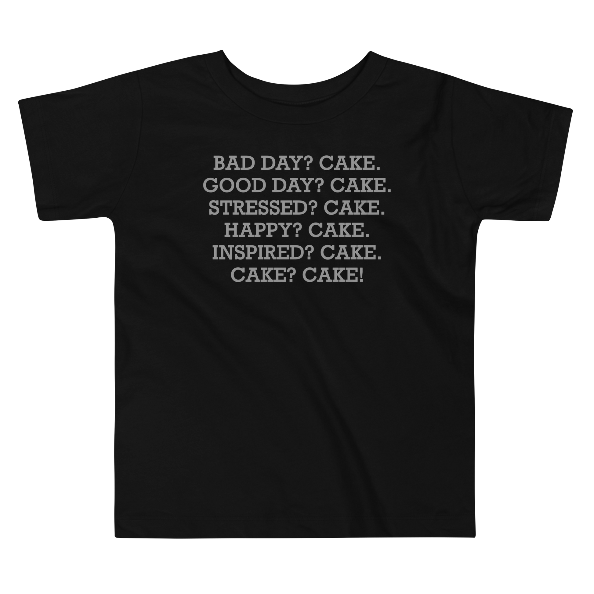 "Bad Day? Cake. Good Day? Cake. Stressed? Cake. Happy? Cake. Inspired? Cake. Cake? Cake!" printed on a black toddler short sleeve tee laying on a flat surface