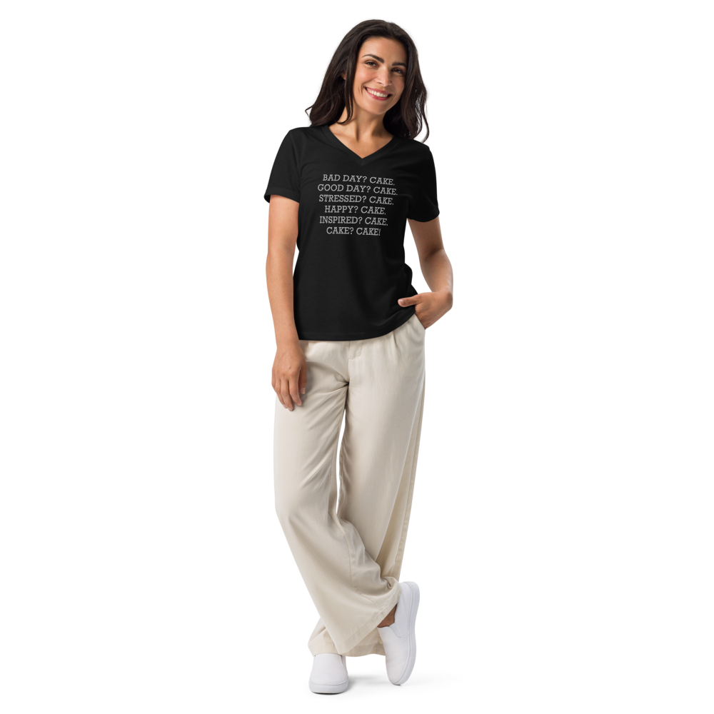 "Bad Day? Cake. Good Day? Cake. Stressed? Cake. Happy? Cake. Inspired? Cake. Cake? Cake!" printed on a solid black blend women's relaxed v-neck t-shirt worn by a female