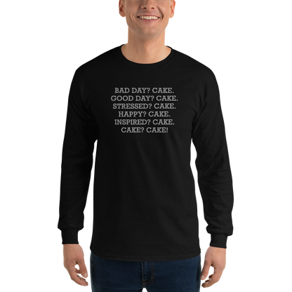"Bad Day? Cake. Good Day? Cake. Stressed? Cake. Happy? Cake. Inspired? Cake. Cake? Cake!" printed on a black men's long sleeve shirt worn by a male
