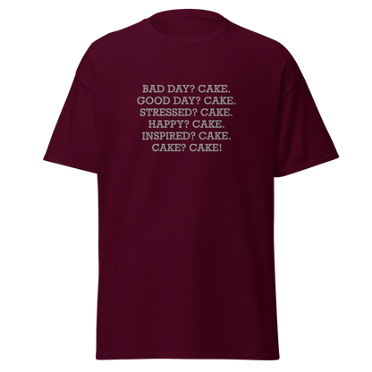 "Bad Day? Cake. Good Day? Cake. Stressed? Cake. Happy? Cake. Inspired? Cake. Cake? Cake!" printed on a maroon on an invisible body