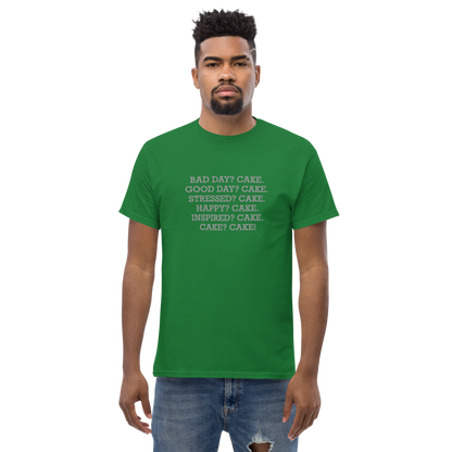 "Bad Day? Cake. Good Day? Cake. Stressed? Cake. Happy? Cake. Inspired? Cake. Cake? Cake!" printed on a turf green unisex classic tee worn by a male