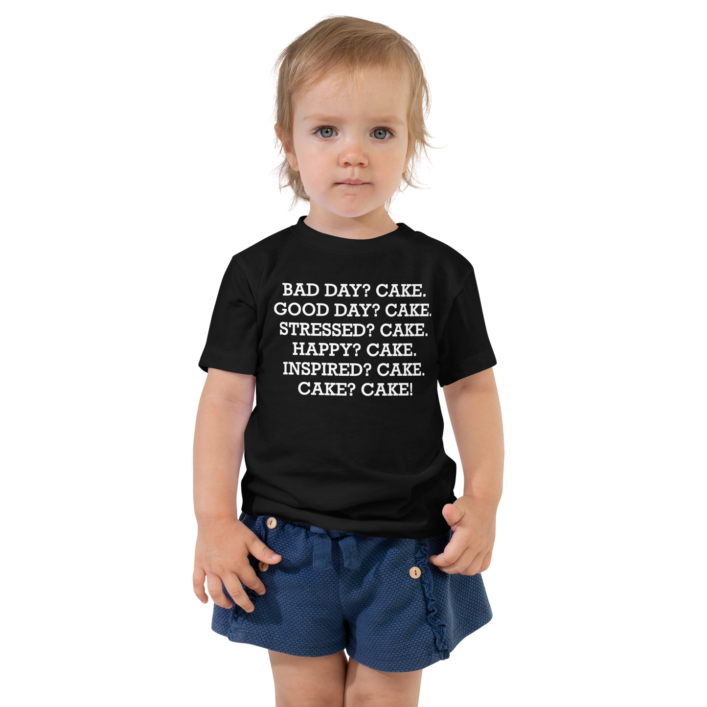 "Bad Day? Cake. Good Day? Cake. Stressed? Cake. Happy? Cake. Inspired? Cake. Cake? Cake!" printed on a black toddler short sleeve tee worn by a female