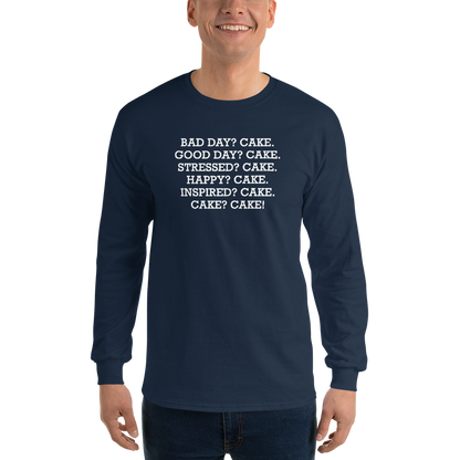 "Bad Day? Cake. Good Day? Cake. Stressed? Cake. Happy? Cake. Inspired? Cake. Cake? Cake!" printed on a navy men's long sleeve shirt worn by a male