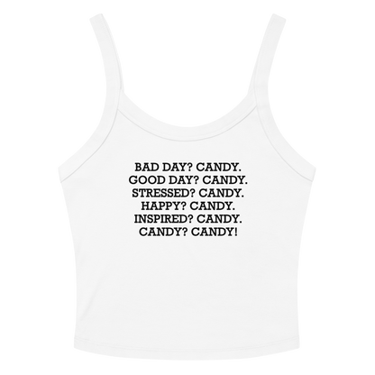 "Bad Day? Candy. Good Day? Candy. Stressed? Candy. Happy? Candy. Inspired? Candy. Candy? Candy!" printed on a solid white blend women's micro-rib tanktop laying on a flat surface amongst sunglasses and shorts