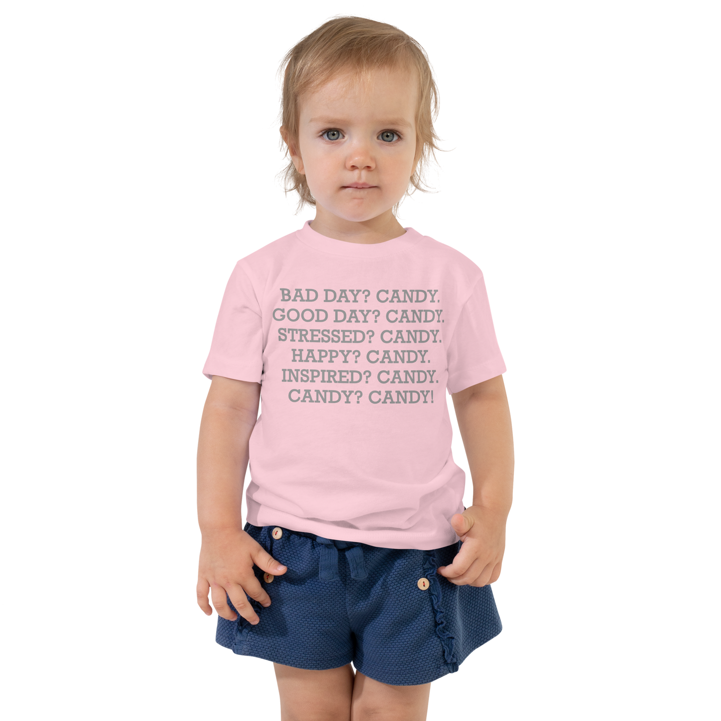 "Bad Day? Candy. Good Day? Candy. Stressed? Candy. Happy? Candy. Inspired? Candy. Candy? Candy!" printed on a pink toddler short sleeve tee worn by a female