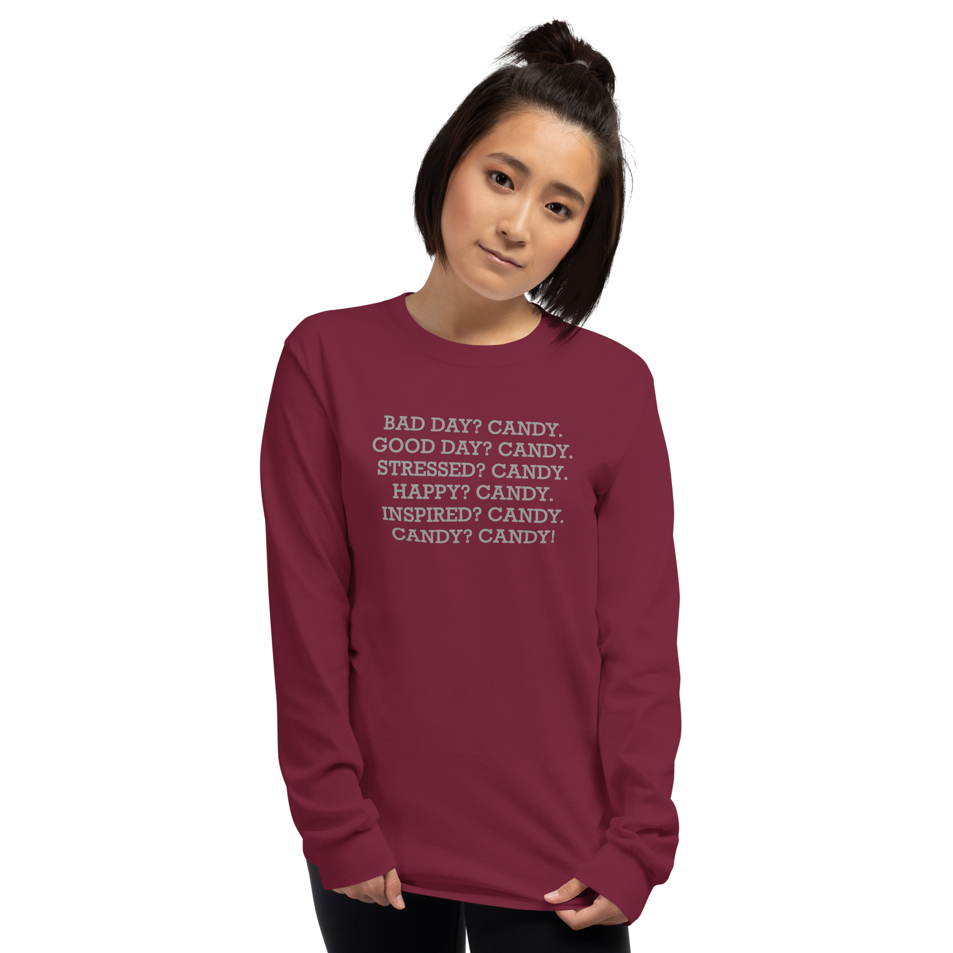 "Bad Day? Candy. Good Day? Candy. Stressed? Candy. Happy? Candy. Inspired? Candy. Candy? Candy!" printed on a maroon men's long sleeve shirt worn by a female