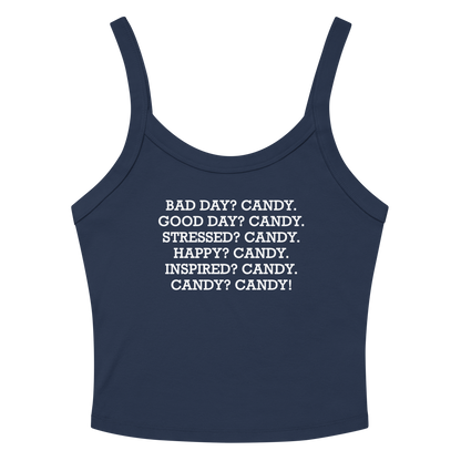 "Bad Day? Candy. Good Day? Candy. Stressed? Candy. Happy? Candy. Inspired? Candy. Candy? Candy!" printed on a solid navy blend women's micro-rib tanktop laying on a flat surface amongst sunglasses and shorts