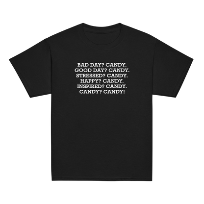 "Bad Day? Candy. Good Day? Candy. Stressed? Candy. Happy? Candy. Inspired? Candy. Candy? Candy!" printed on a black youth classic tee laying on a flat surface