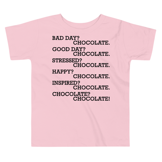 "Bad Day? Chocolate. Good Day? Chocolate. Stressed? Chocolate. Happy? Chocolate. Inspired? Chocolate. Chocolate? Chocolate!" printed on a pink toddler short sleeve tee laying on a flat surface