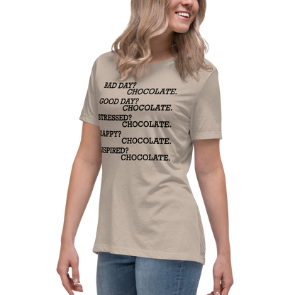 "Bad Day? Chocolate. Good Day? Chocolate. Stressed? Chocolate. Happy? Chocolate. Inspired? Chocolate. Chocolate? Chocolate!" printed on a heather stone women's relaxed t-shirt worn by a female