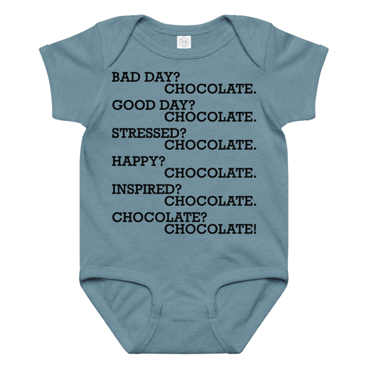 "Bad Day? Chocolate. Good Day? Chocolate. Stressed? Chocolate. Happy? Chocolate. Inspired? Chocolate. Chocolate? Chocolate!" printed on a vintage indigo baby jersey bodysuit laying on a flat surface amongst other clothes