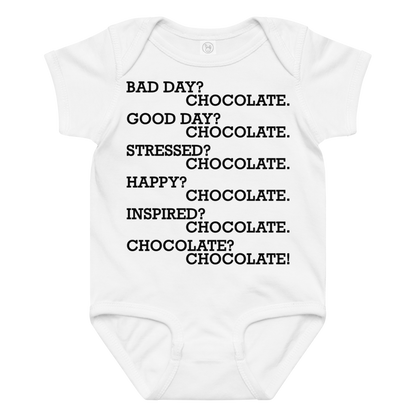 "Bad Day? Chocolate. Good Day? Chocolate. Stressed? Chocolate. Happy? Chocolate. Inspired? Chocolate. Chocolate? Chocolate!" printed on a white baby jersey bodysuit laying on a flat surface amongst other clothes